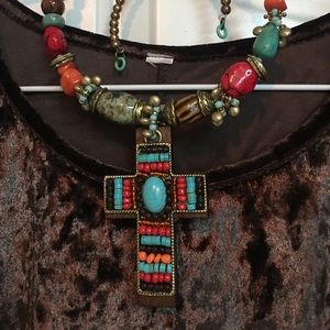 Karen Kane velvet type material; beautiful brown color;very comfortable S top.